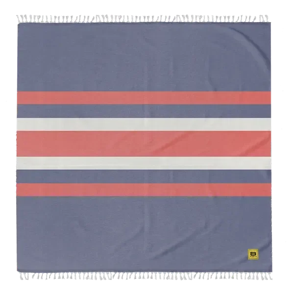 Blue oversized blanket with coral and white horizontal stripes and fringed edges