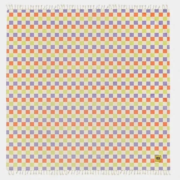 Bright checkered oversized blanket with repeating rows of coral, yellow, purple, and gray squares