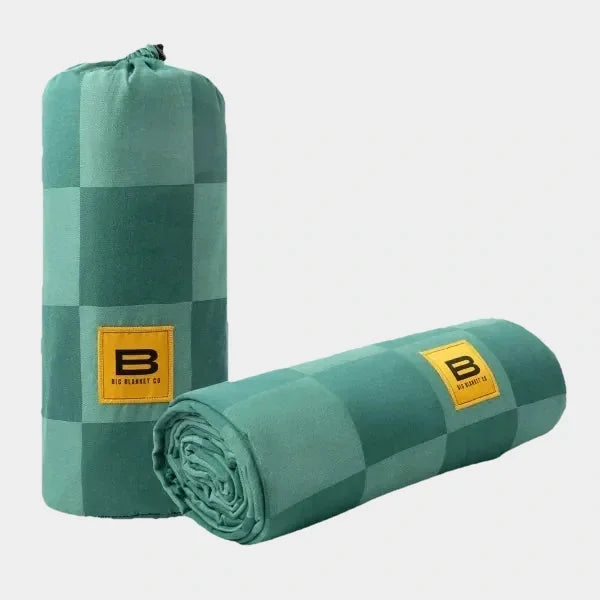 Rolled and packaged palm green checkered oversized blanket with Big Blanket Co yellow label