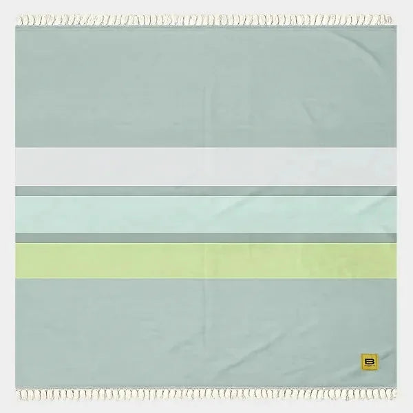 Big Beachy Blanket in Tidepool Stripes with cream fringe, featuring horizontal bands of sage green, white, light mint, and chartreuse