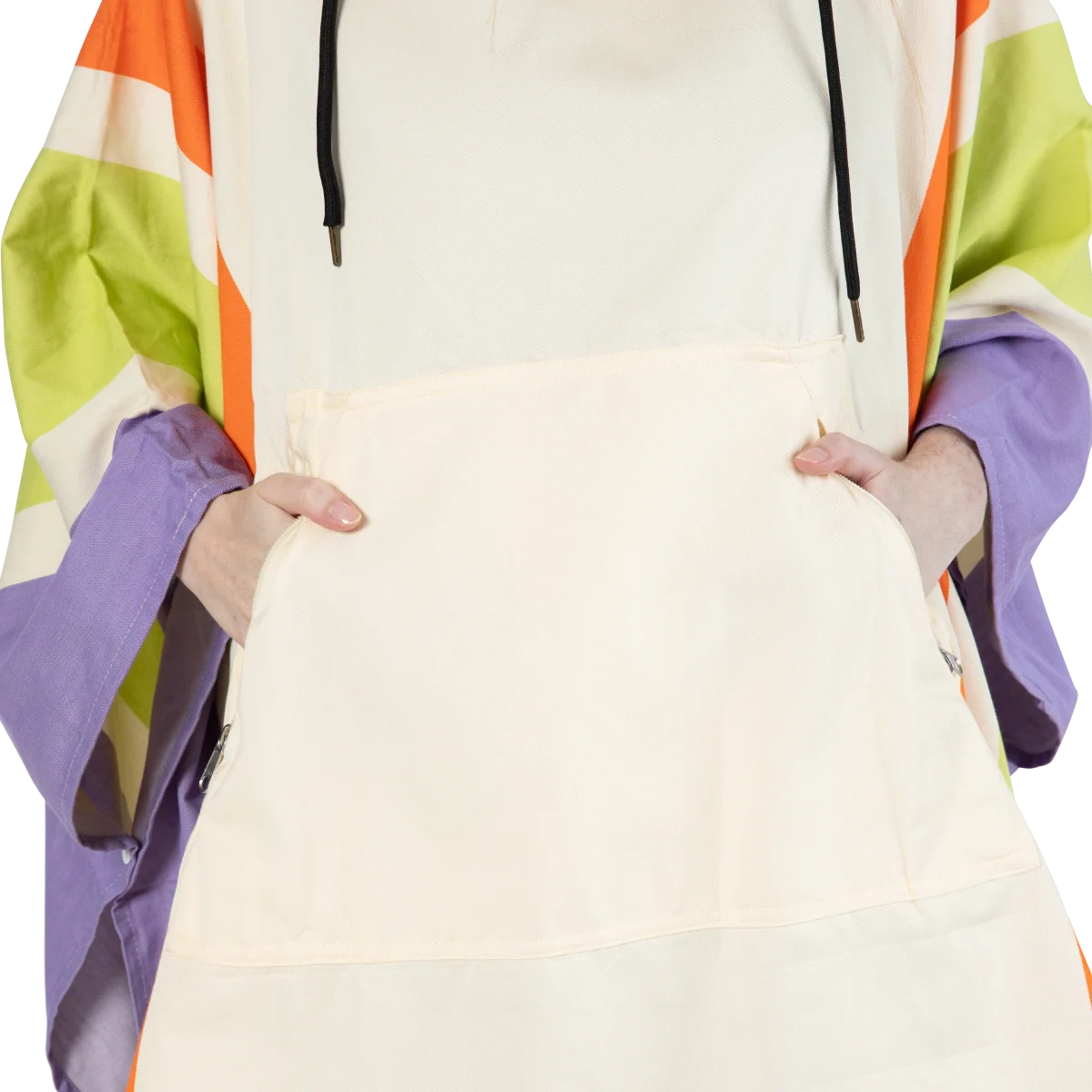 Person holding oversized cream poncho with bright orange, lime green, and purple color-block stripes