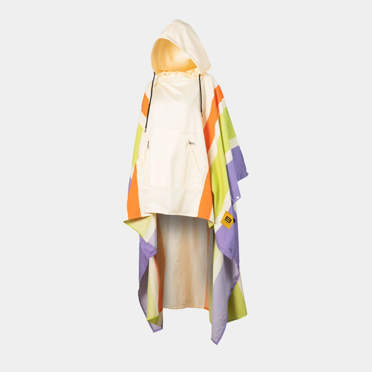 Colorful striped oversized poncho blanket in cream, orange, lime green, and purple draped over figure with hood