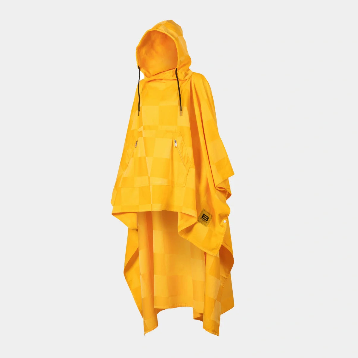 Golden yellow oversized poncho with checkered pattern and hood draped on figure