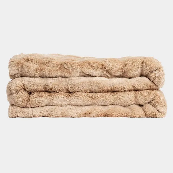 Beige Cloud Luxe oversized blanket stacked in soft, plush folds showing luxurious texture
