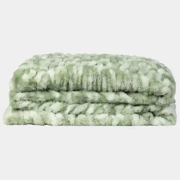 Sage green Cloud Luxe oversized blanket with textured quilted pattern, folded stack view