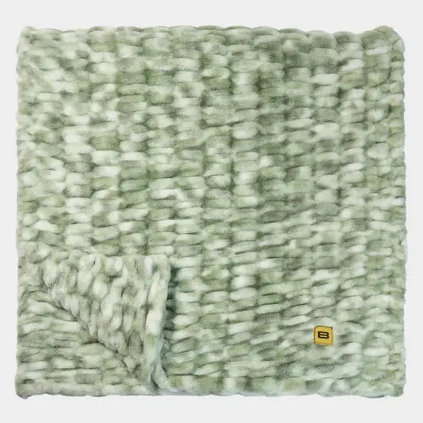 Sage green chunky knit oversized blanket with white flecks, folded corner detail