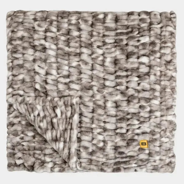 Cloud Luxe Blanket in Onyx Sky, gray and cream chunky knit oversized blanket with tasseled edge and folded corner detail