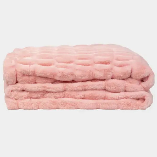 Blush pink quilted oversized blanket folded with fluffy texture and dimensional pattern