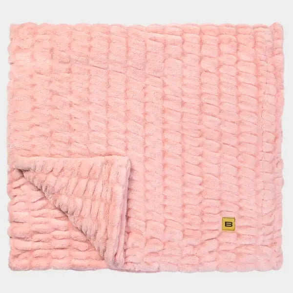Rose Cloud Luxe oversized blanket with textured puff quilting and folded corner detail