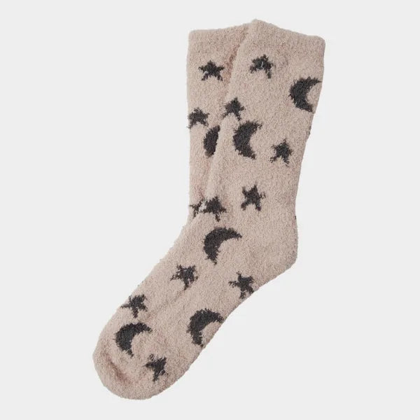Beige cozy socks with black stars and moon pattern