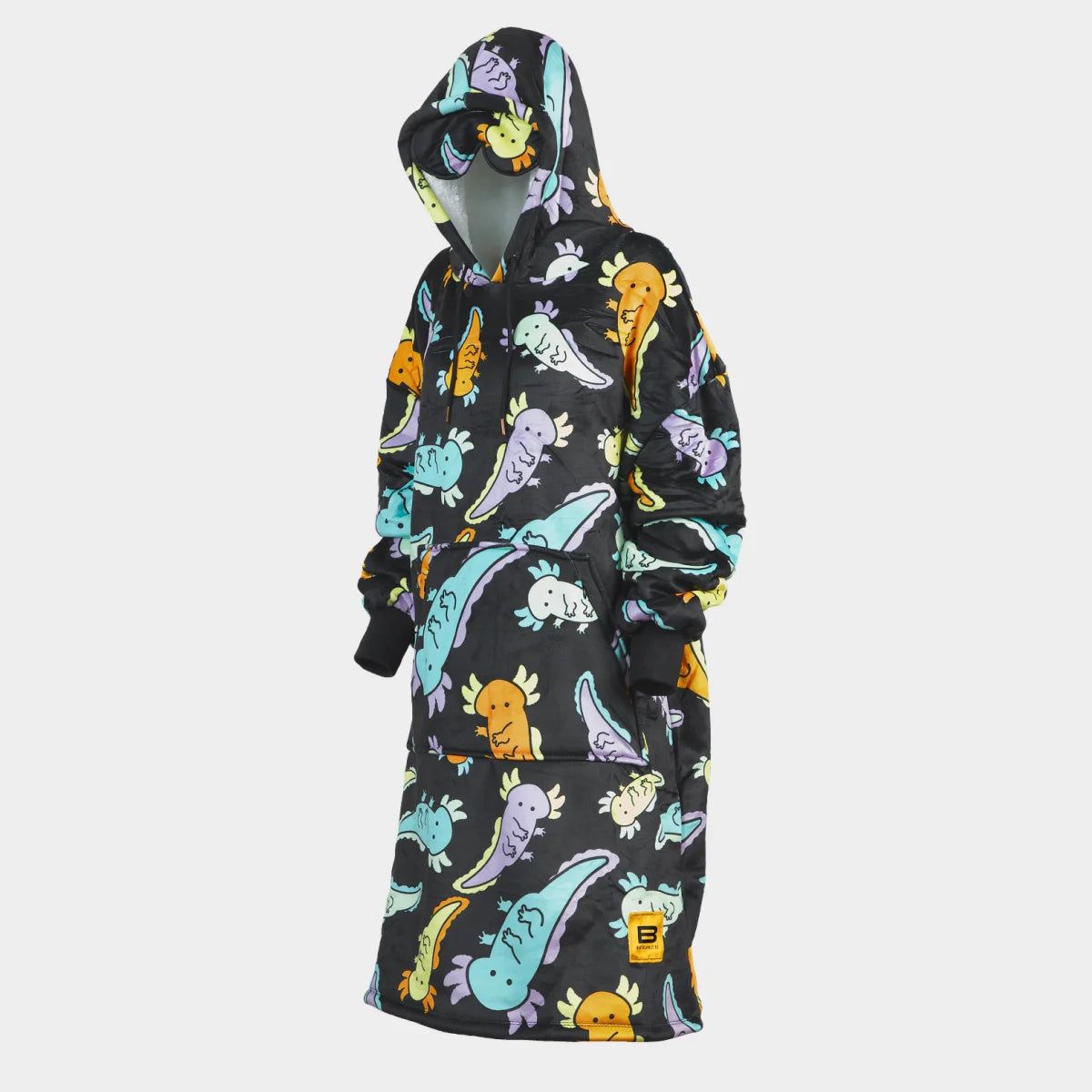 Hideout Hoodie™ wearable blanket in Axolotl Drift, side view — charcoal ground scattered with pastel axolotls in mint, lavender, aqua and marigold