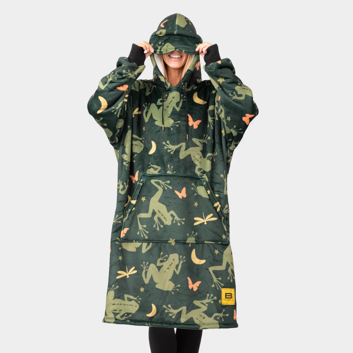 Person wearing the Dreamy Frogs Hideout Hoodie™, pulling the oversized hood down over their eyes