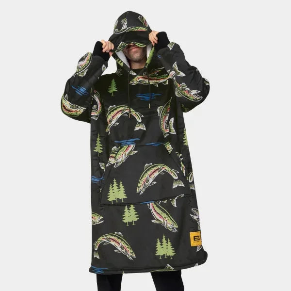 Black oversized hoodie blanket with tacos and pine trees pattern, model wearing with hood up