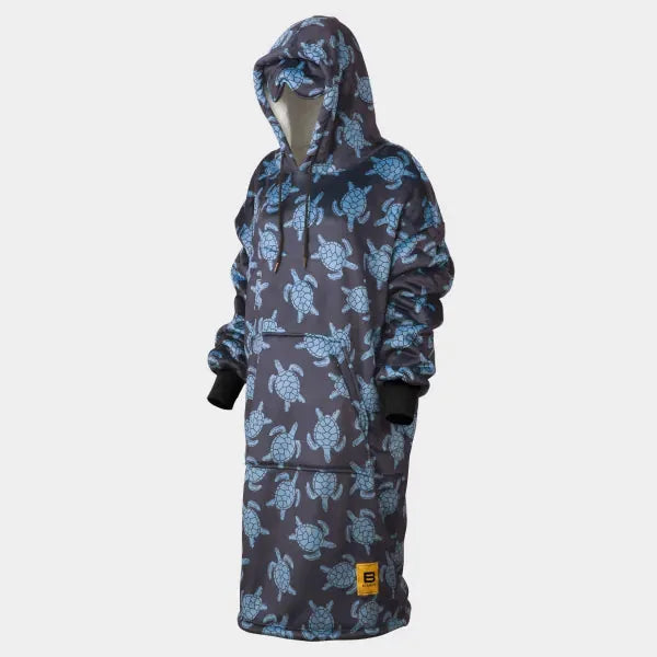 Navy blue oversized wearable blanket hoodie with sea turtle print, featuring drawstring hood and black cuffs