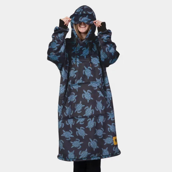 Hideout Hoodie in navy with blue turtle print, model wearing it with hood up and sunglasses