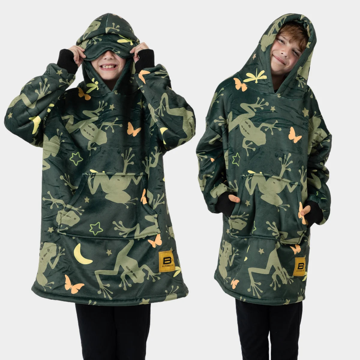 Front and back views of a child wearing the Dreamy Frogs Hideout Hoodie™ Kids wearable blanket