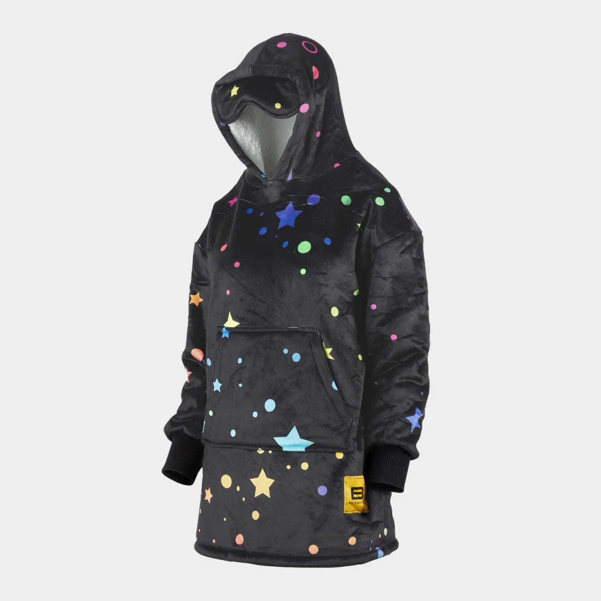 Hideout Hoodie™ Kids wearable blanket in Electric Sky, side view with the built-in eye mask on the hood — charcoal ground scattered with multicolour stars, sparkles and dots in pink, teal, yellow, blue and green