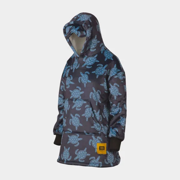Navy oversized hoodie blanket with blue sea turtle pattern and yellow brand label