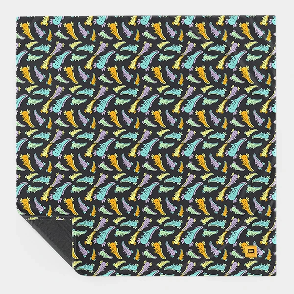 Axolotl Drift Original Stretch™ blanket laid flat with one corner turned back, showing the full repeating print