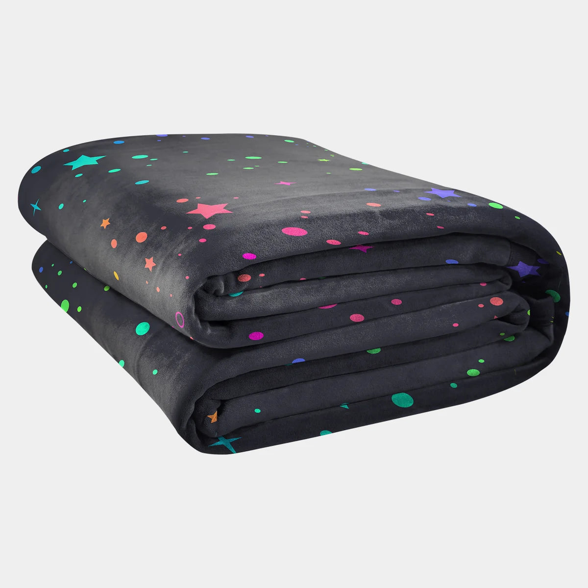 Original Stretch™ oversized blanket in Electric Sky, folded into a stack — charcoal ground scattered with multicolour stars, sparkles and dots in pink, teal, yellow, blue and green