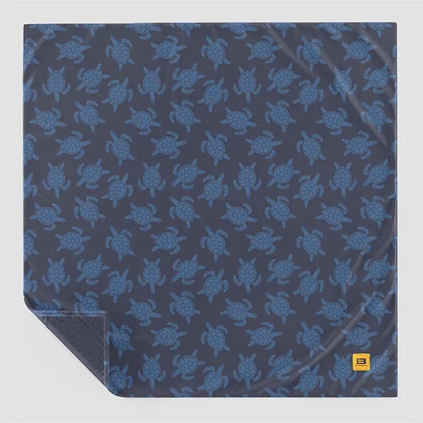 Navy blue oversized blanket with all-over sea turtle print pattern