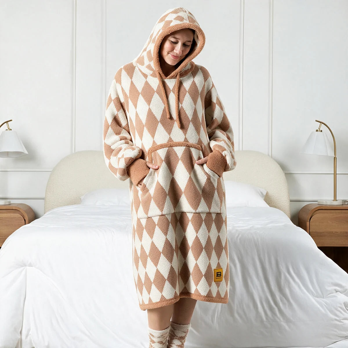 Person standing in a bedroom wearing the Dusty Diamond Premier Plush™ Hoodie with the hood up