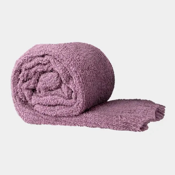 Mauve Premier Plush oversized blanket rolled and draped showing soft texture