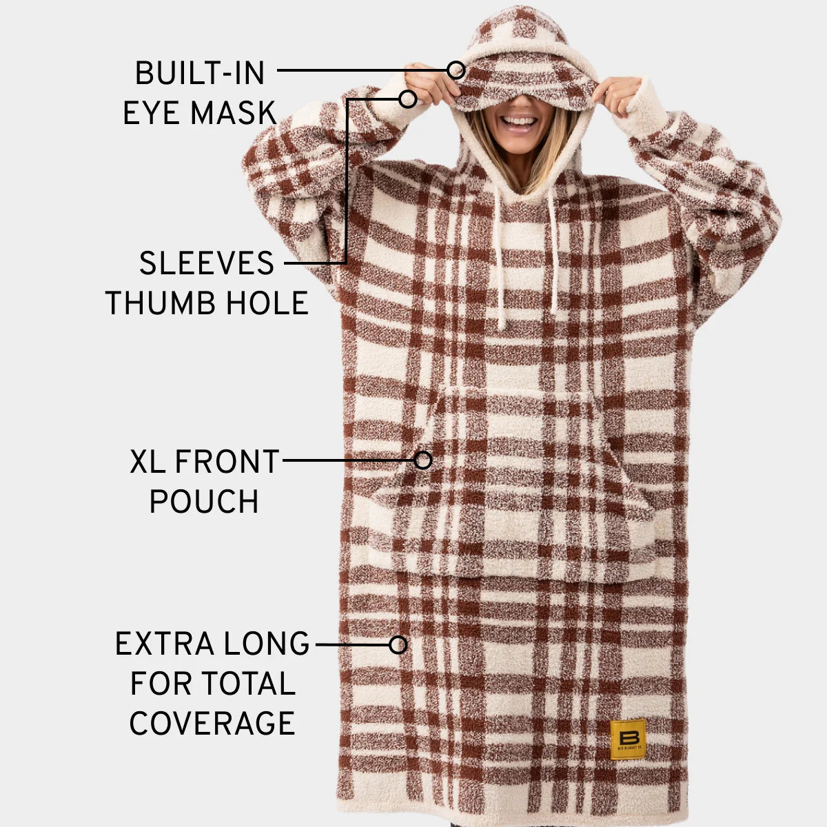 Cream and brown plaid oversized wearable blanket hoodie with built-in eye mask, sleeve thumb holes, XL front pouch, and extra-long coverage