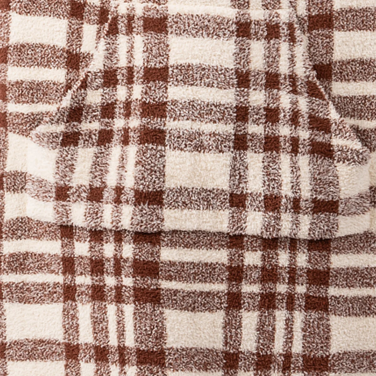 Brown and cream plaid oversized blanket with soft textured fabric in autumn color palette