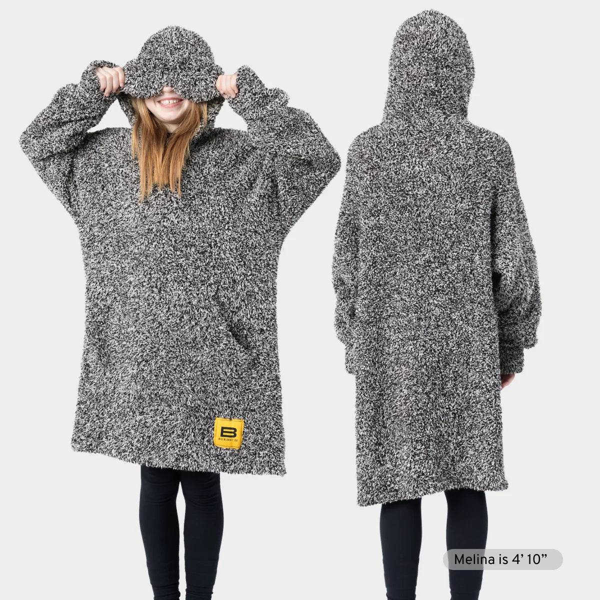 Gray heather oversized hoodie blanket with drawstring hood worn by two men, featuring kangaroo pocket and Big Blanket Co logo patch