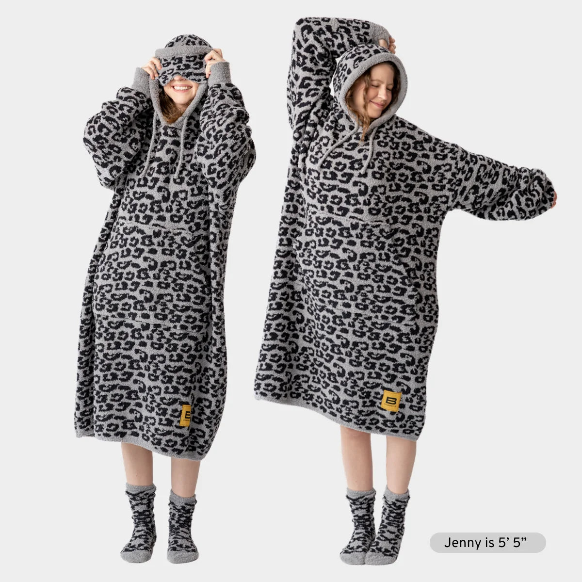 Child wearing black leopard print oversized hoodie blanket with hood and matching socks, front and back views