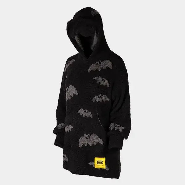 Black oversized hoodie blanket with gray bat print, hood up on child figure, yellow Big Blanket Co tag visible
