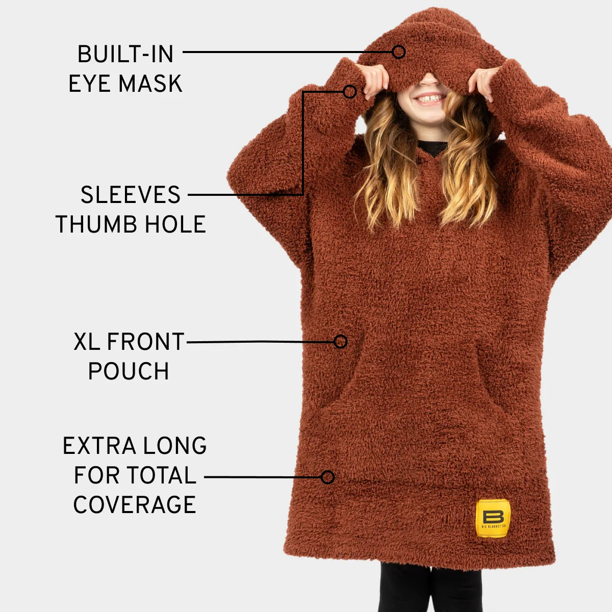 Chocolate brown oversized hoodie blanket with built-in eye mask, thumb holes, and XL front pouch