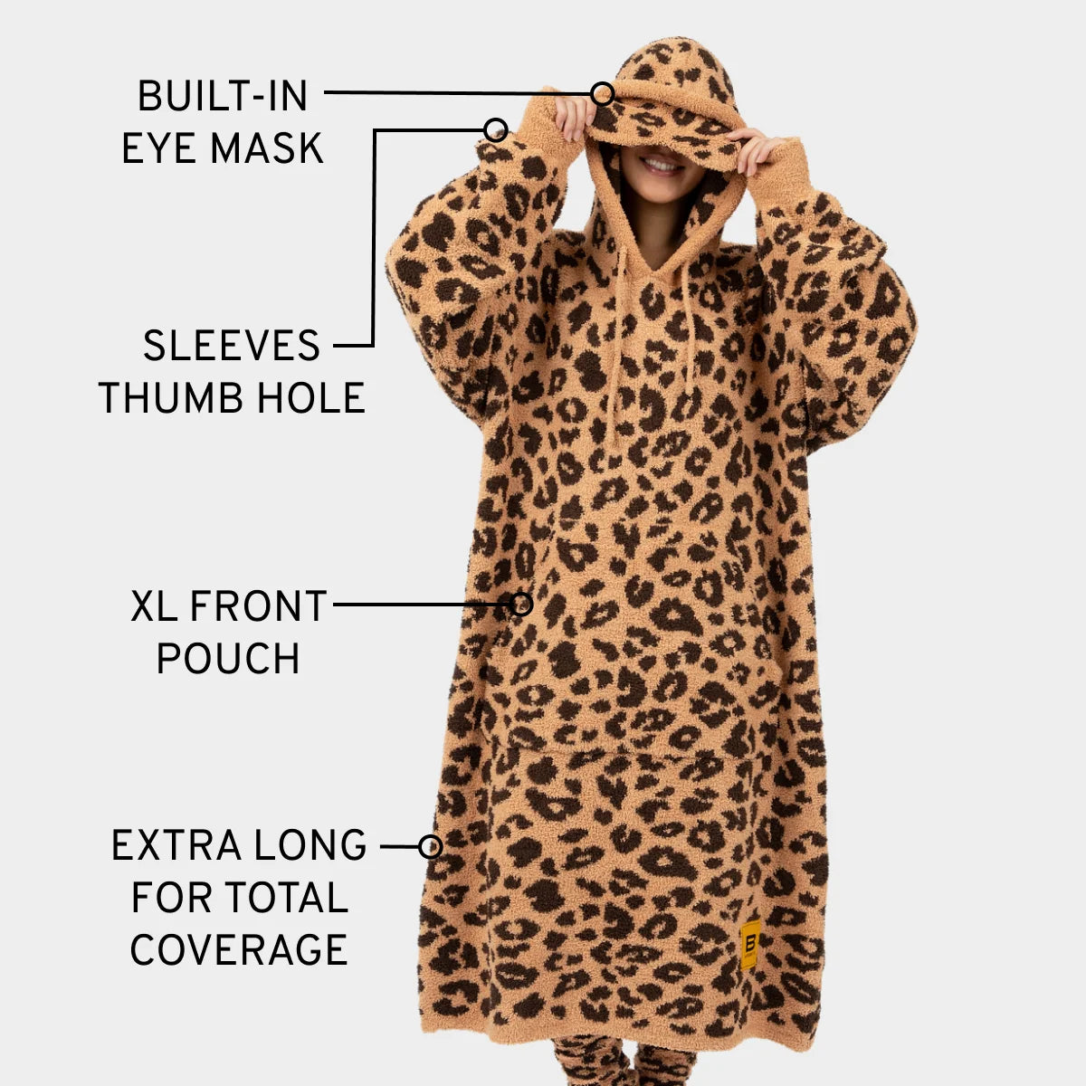 Tan and black leopard print oversized blanket hoodie with built-in eye mask, thumb holes, and XL front pouch