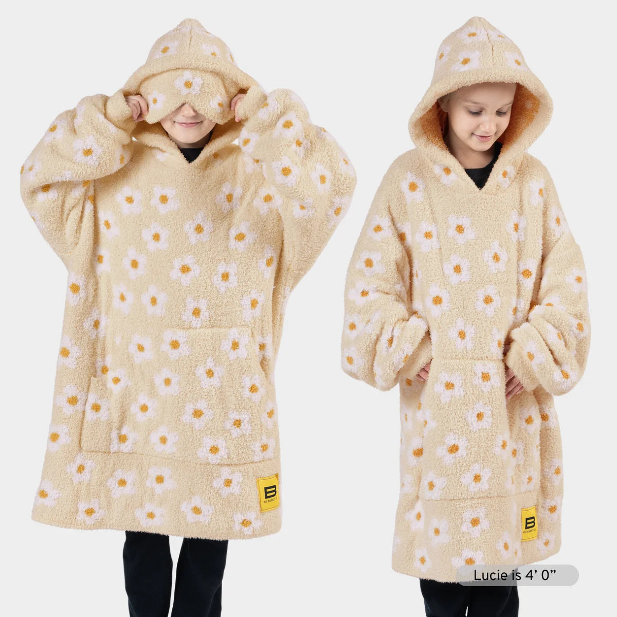 Oversized cream hoodie blanket with yellow daisy print, front and back view on model