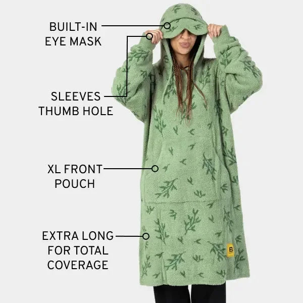 Green oversized hoodie blanket with built-in eye mask, thumb hole sleeves, XL front pouch, and extra-long coverage for kids