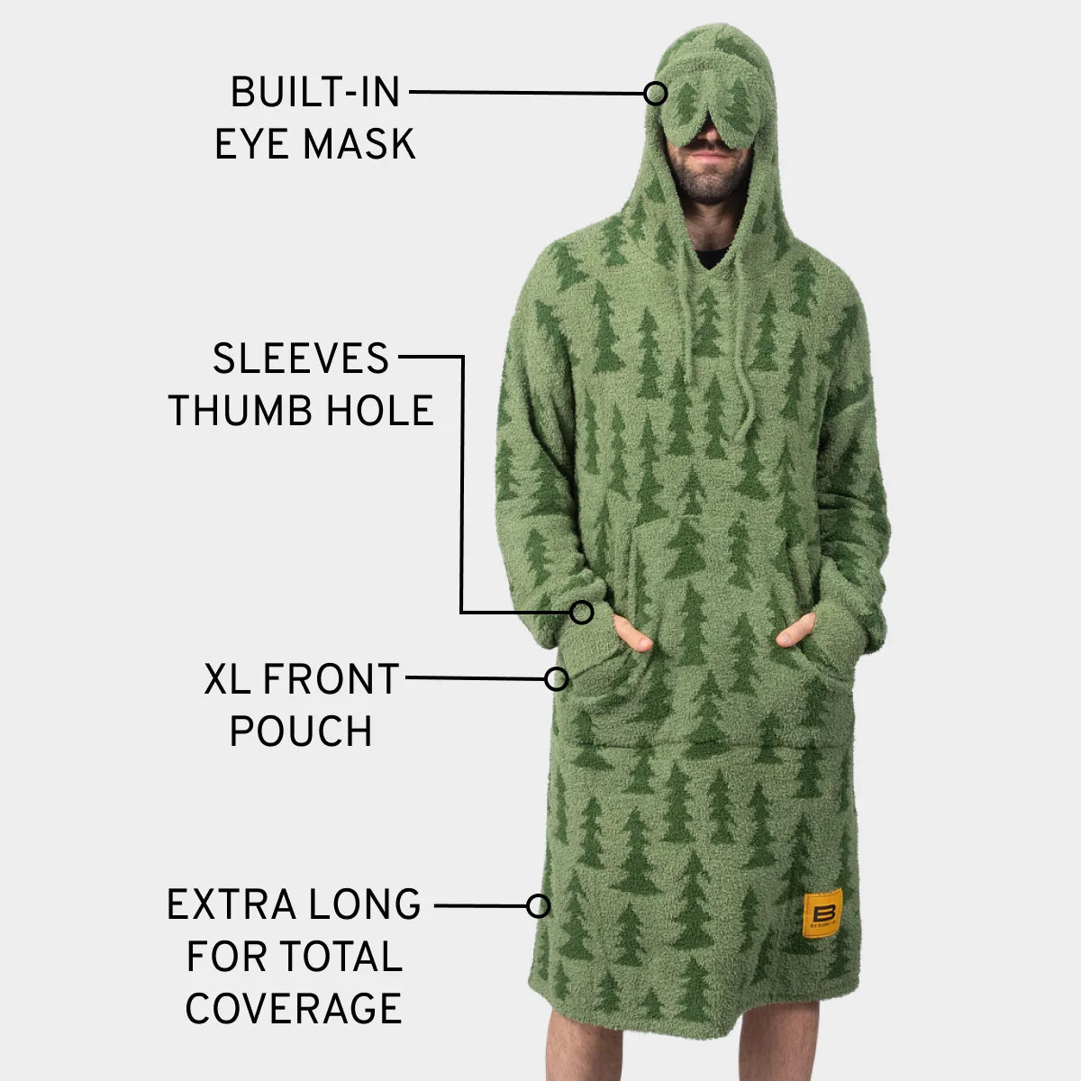 Green oversized hoodie blanket with forest tree pattern, built-in eye mask, thumb holes, and front pouch
