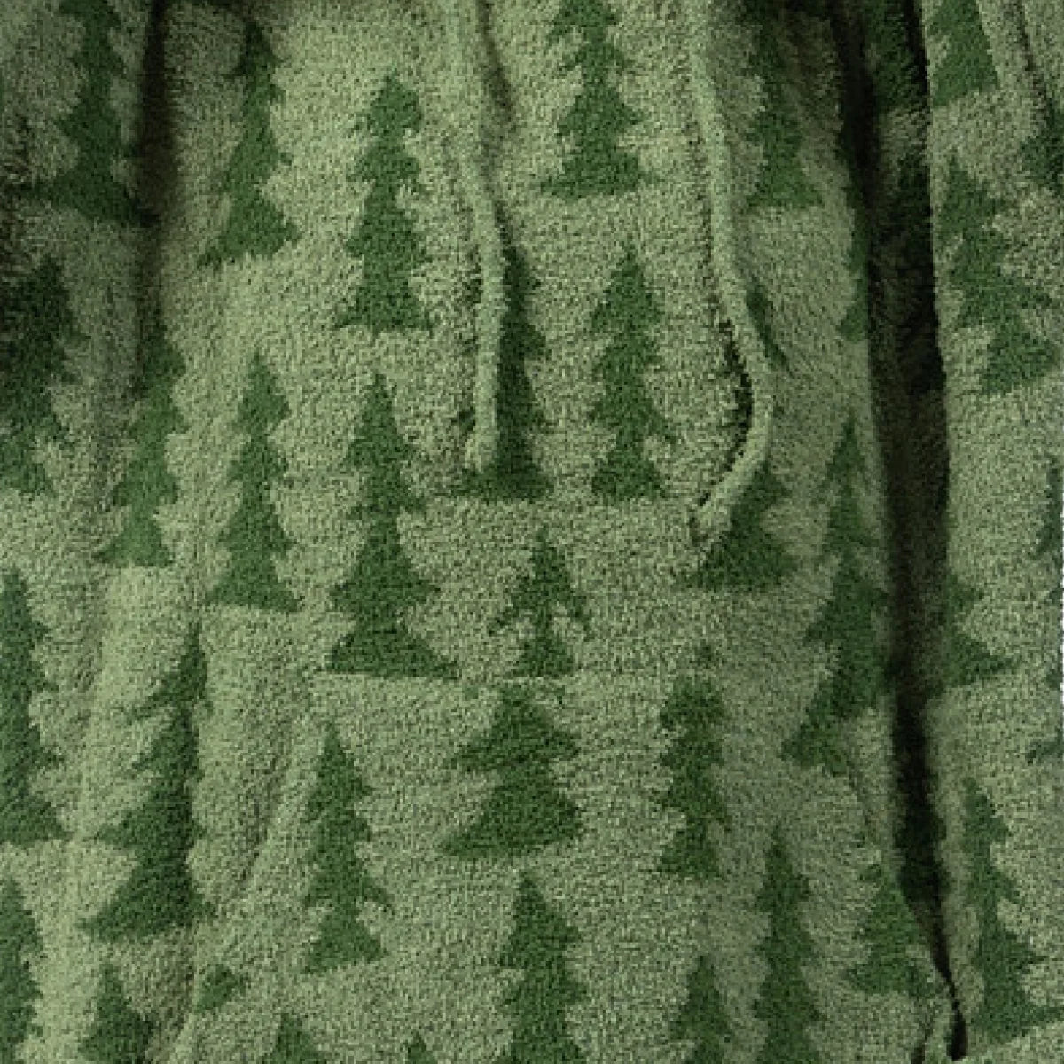 Sage green oversized blanket with forest tree pattern and soft textured fabric, draped to show thickness and plushness