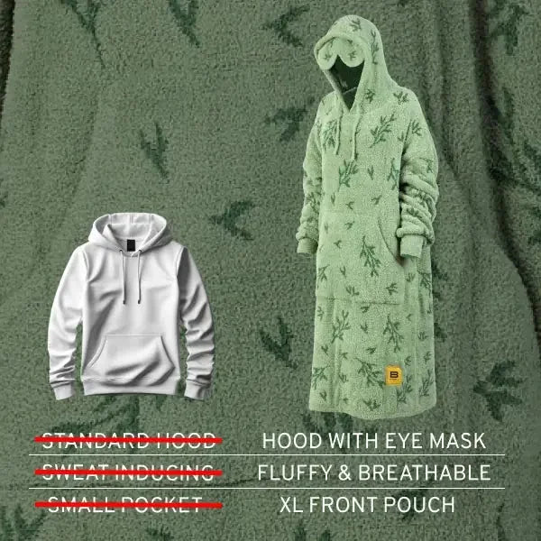 Oversized sage green hoodie blanket with botanical print, displayed on model wearing hood with eye mask detail, shown against matching green textured background