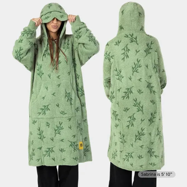 Sage green oversized hoodie blanket with fern print, front and back view, featuring kangaroo pocket and drawstring hood