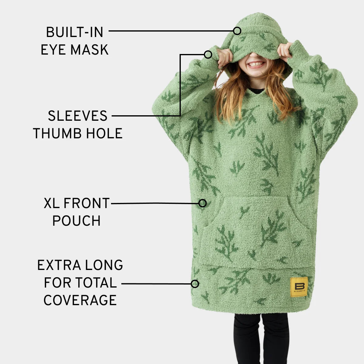 Green oversized wearable blanket hoodie with built-in eye mask, sleeves with thumb holes, front pouch, and extra-long coverage for kids