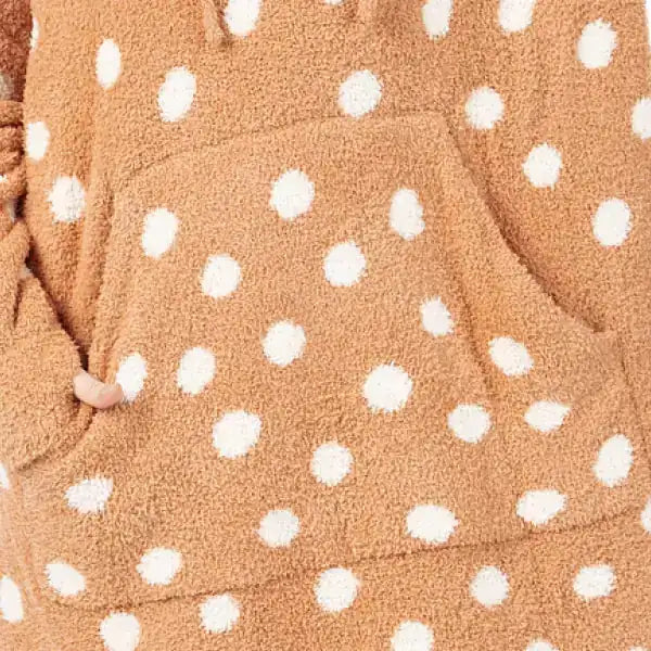 Tan oversized blanket with white polka dots, soft plush texture bunched together