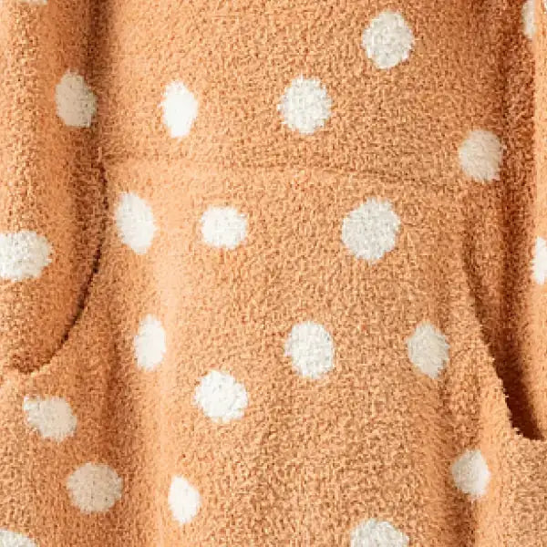 Caramel oversized blanket with white polka dot pattern, textured plush fabric