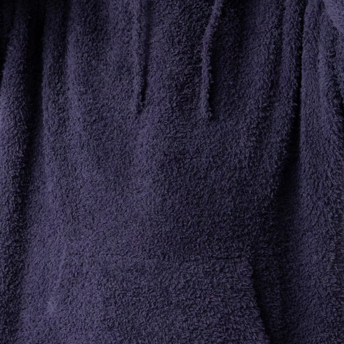 Navy blue plush oversized hoodie blanket with soft textured fabric and vertical folds