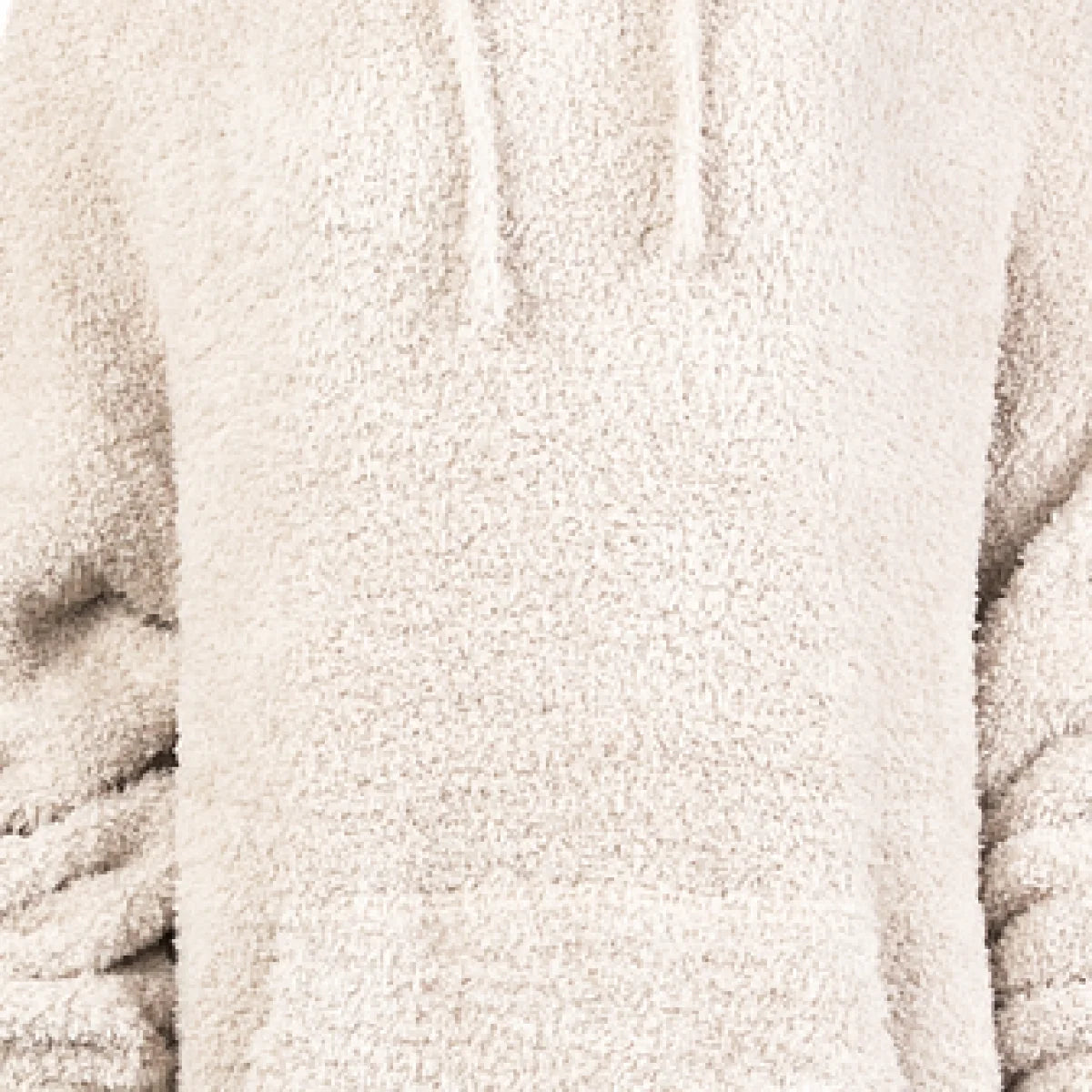 Cream-colored oversized blanket hoodie with soft plush texture and ribbed fabric panels
