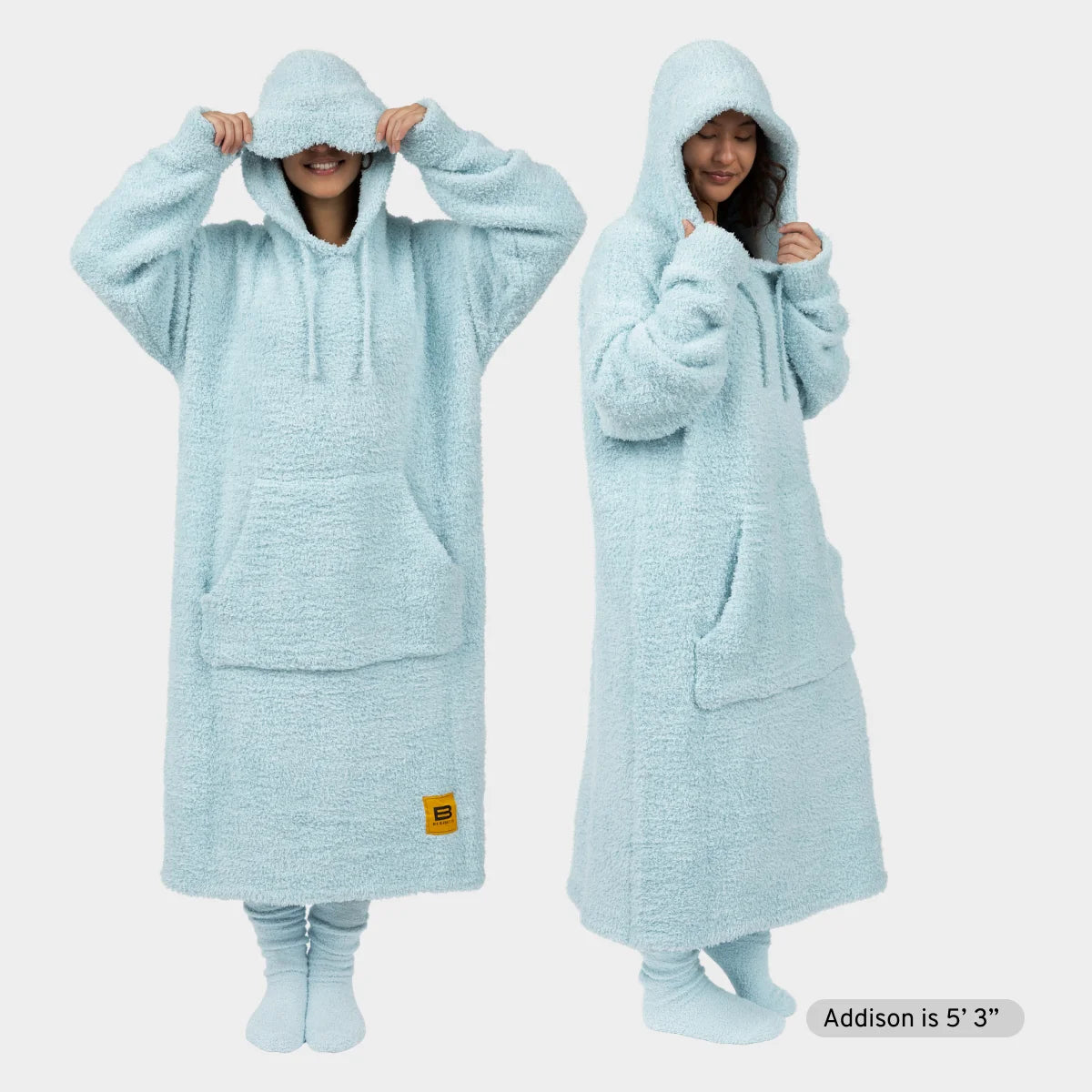Light blue oversized hoodie blanket with kangaroo pocket and hood, modeled on woman in front and side view