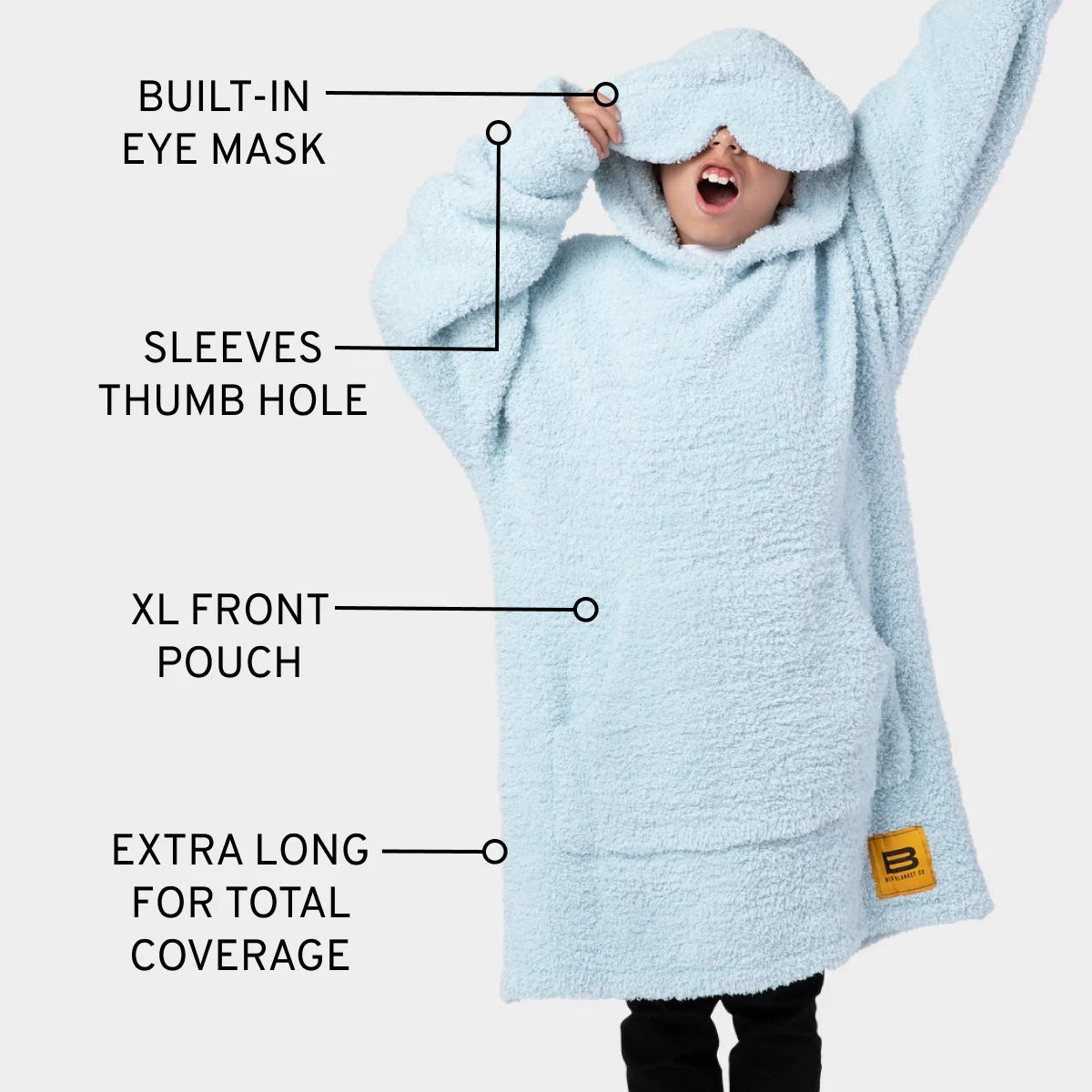 Light blue oversized hoodie blanket with built-in eye mask, thumb hole sleeves, XL front pouch, and extra long coverage for kids