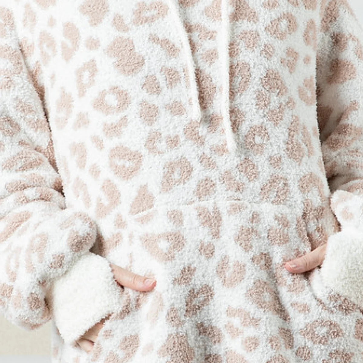 Cream and tan snow leopard patterned oversized blanket hoodie with plush texture and deep front pocket