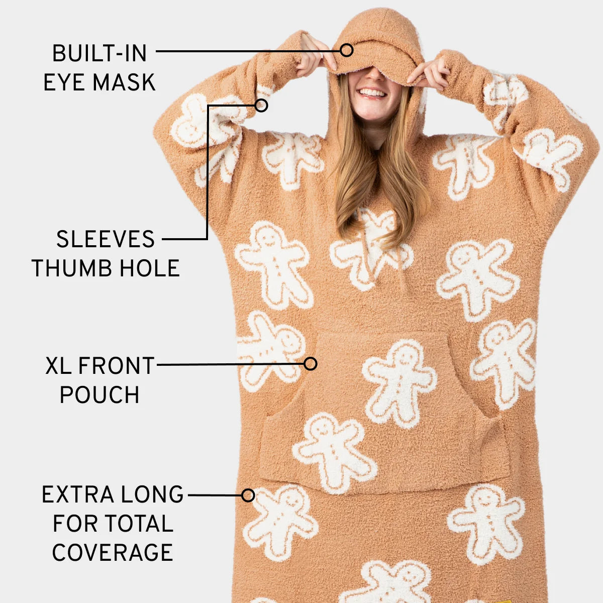 Tan and cream gingerbread man pattern hoodie blanket with built-in eye mask, thumb holes, and oversized front pouch