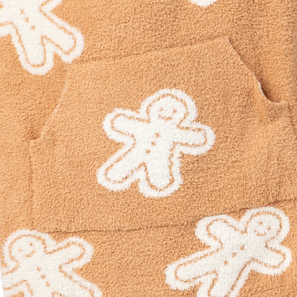 Tan oversized blanket with white gingerbread man pattern, cozy textured fabric, Premier Plush Hoodie design